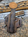 Buffalo 1911 holster with rattlesnake inlay.