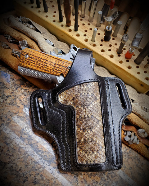 Black on Black 1911 holster with rattlesnake inlay.